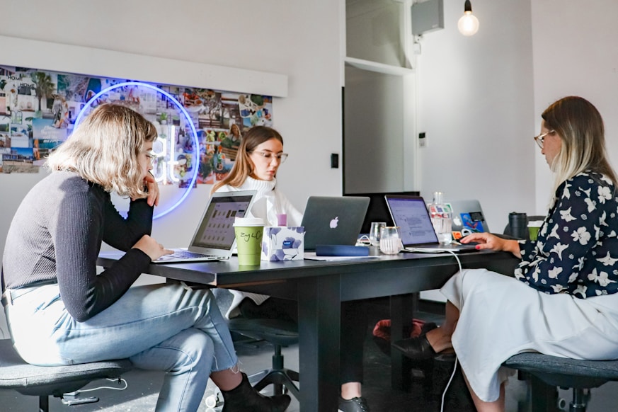 Corporate professionals in a startup workspace